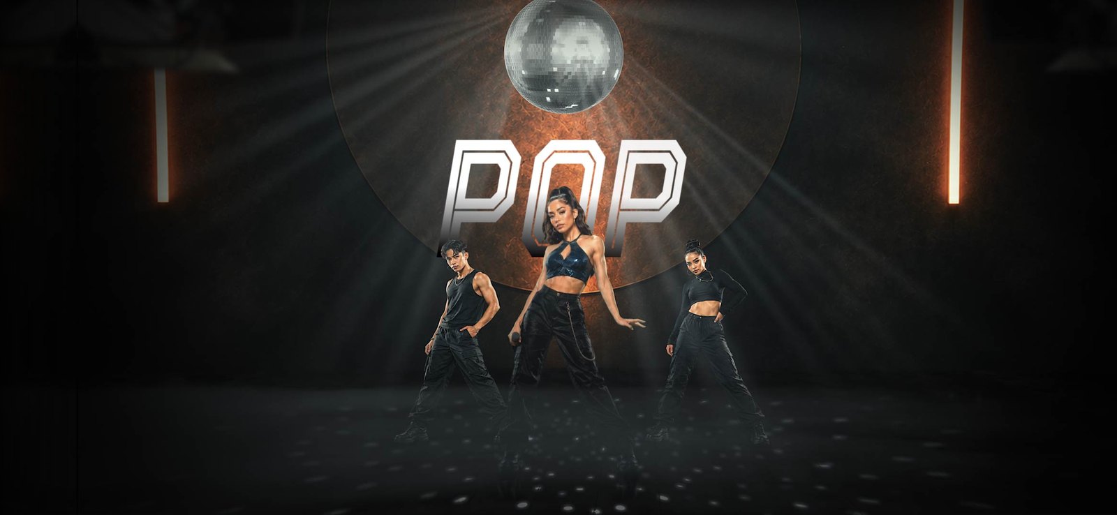 Pop dancers under a disco ball